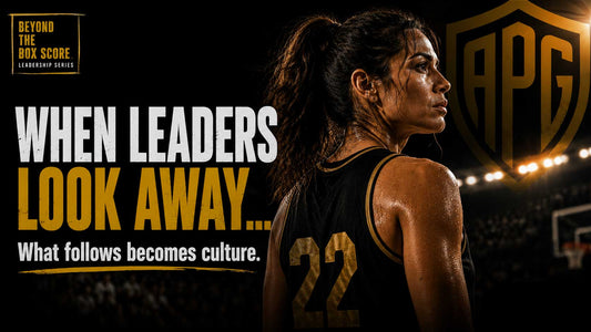 Female basketball player in jersey number 22 looking away from the camera in a dark arena, with text reading 'When Leaders Look Away... What follows becomes culture.' — Athletic Pride Gear Leadership Series