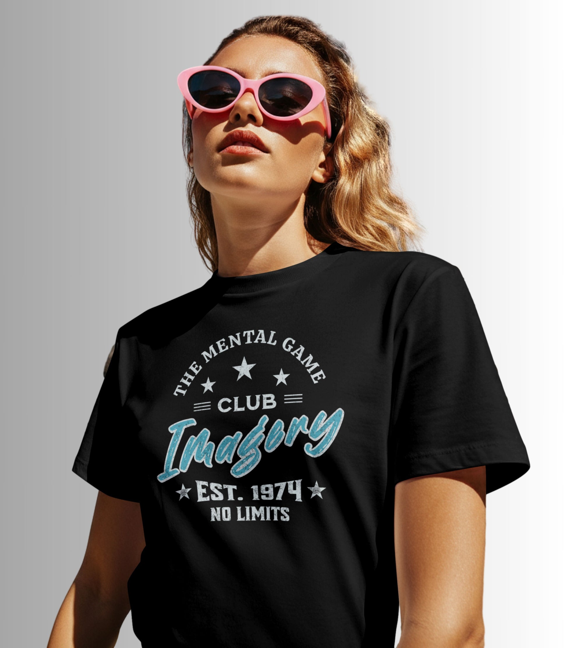 Black t-shirt featuring a vintage-style text design that reads “The Mental Game Club,” “Imaginary,” “Est. 1974,” and “No Limits,” arranged with stars and decorative lines.