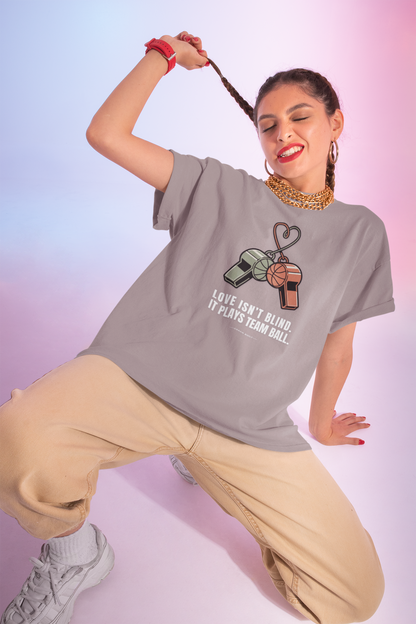 Love Isn’t Blind (white text) — It Plays Team Ball Tee