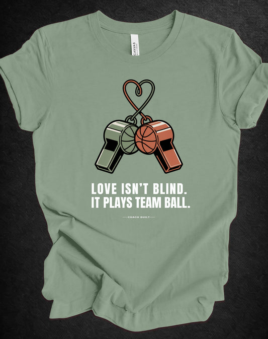 Love Isn’t Blind (white text) — It Plays Team Ball Tee