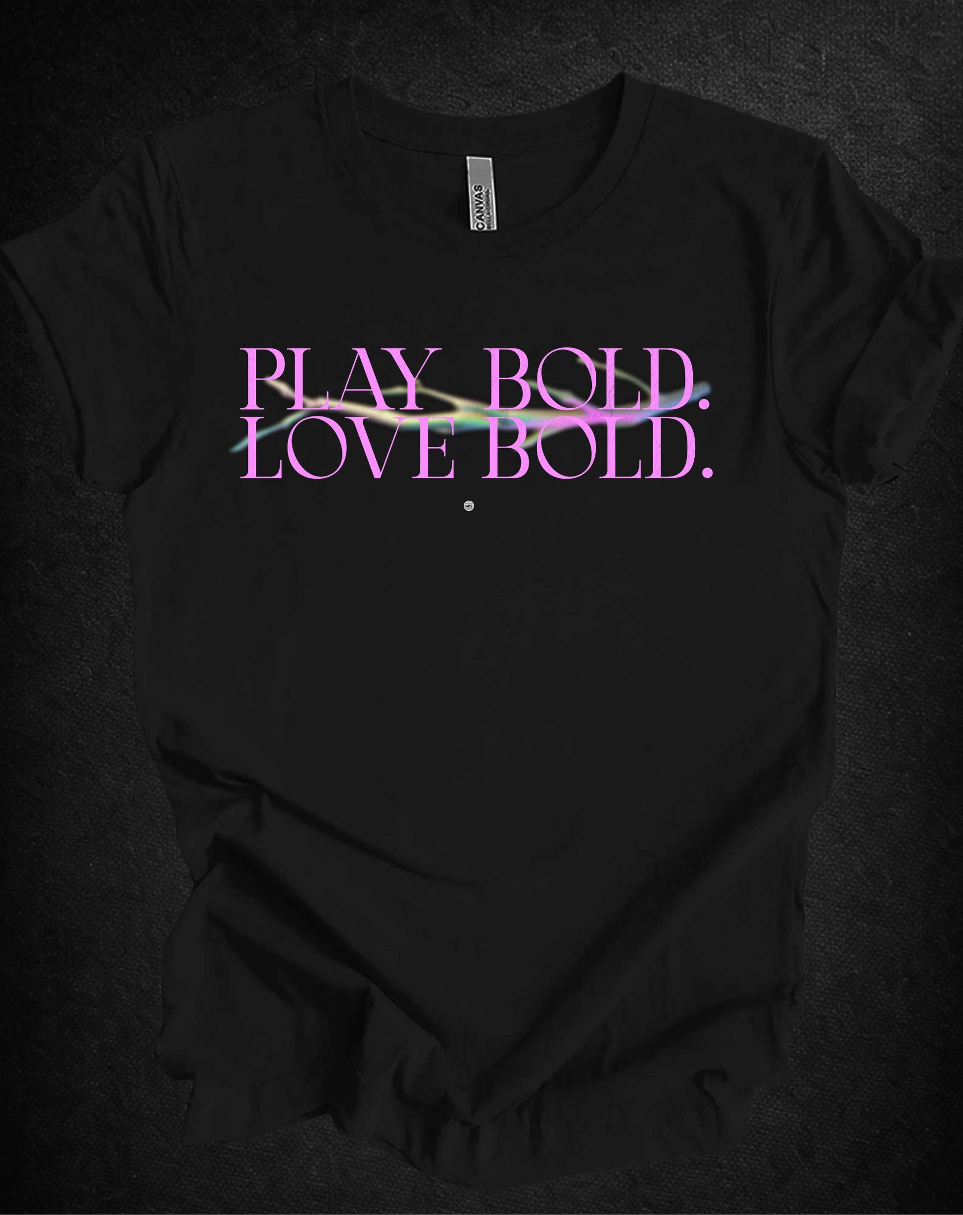 Black t-shirt with 'Play Bold Love Bold' text on a dark background