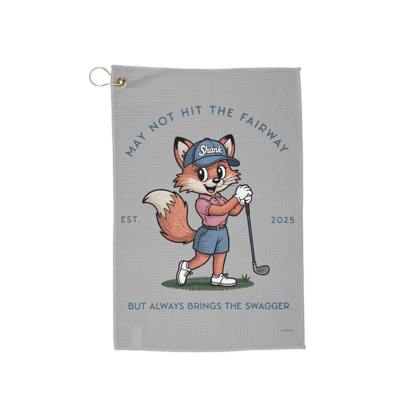 Golf towel with a cartoon fox character holding a golf club on a gray background